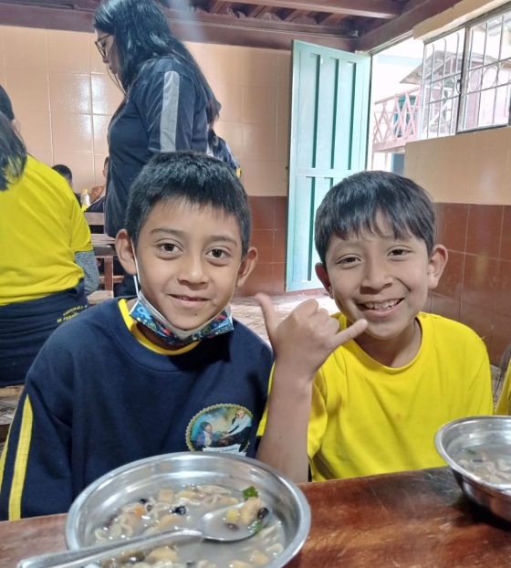 Boys eating Mary's Meals in Ecuador