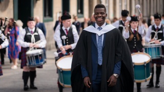 Image of a young man graduating.